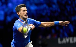 Novak Djokovic lunging for ball