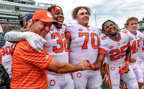 Clemson head coach Dabo Swinney, defensive tackle Etinosa Reuben, offensive lineman Tristan Leigh, and safety Jalyn Phillips