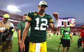 Green Bay Packers quarterback Aaron Rodgers walking off the field after a win