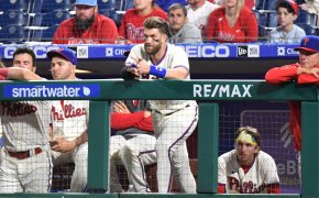 Bryce Harper looks on from the dugout