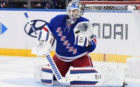 New York Rangers goaltender Igor Shesterkin makes a glove save against the New Jersey Devils