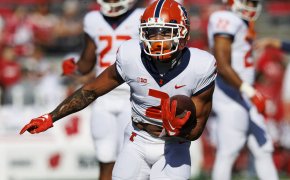 Illinois Fighting Illini running back Chase Brown carries the football