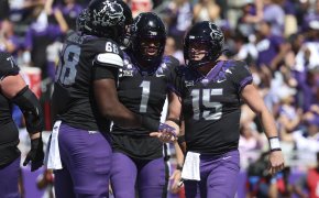 TCU Horned Frogs quarterback Max Duggan celebrates with TCU Horned Frogs wide receiver Quentin Johnston