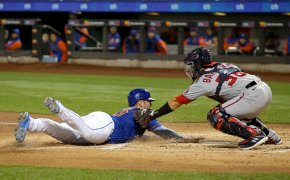 New York Mets first baseman Pete Alonso sliding into home