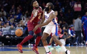 Philadelphia 76ers guard James Harden battles for the ball with Cleveland Cavaliers guard Donovan Mitchell