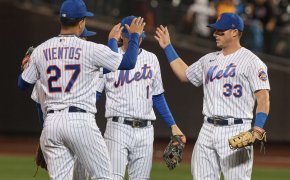 Mets players celebrating a win