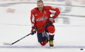 Washington Capitals left wing Alex Ovechkin kneels on ice