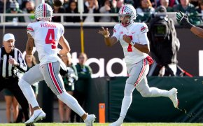 Ohio State Buckeyes quarterback C.J. Stroud throws the ball to wide receiver Julian Fleming