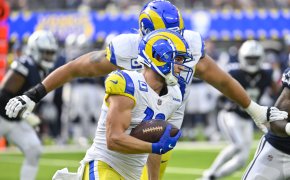 Los Angeles Rams wide receiver Cooper Kupp carries the ball as offensive tackle Rob Havenstein follows