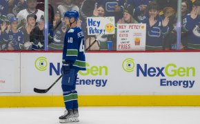 Vancouver Canucks forward Elias Pettersson skates in front of fans during warm up prior to a game