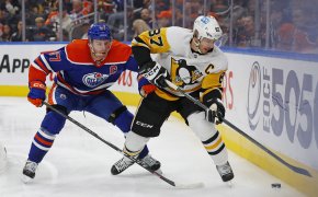 Sidney Crosby defended by Connor McDavid