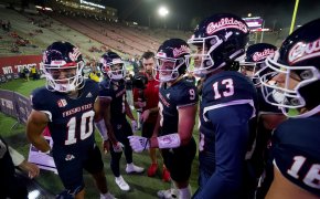 Fresno State Bulldogs quarterback Jake Haener meets with teammates