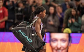 Gauff carrying her tennis bag