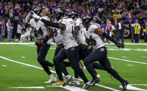 Baltimore Ravens players celebrating interception