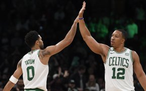 Boston Celtics forward Grant Williams high fives forward Jayson Tatum
