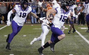 Texas Christian Horned Frogs quarterback Max Duggan keeps the ball for yards