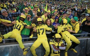 Oregon Ducks leap into the stands