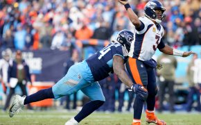 Denver Broncos quarterback Russell Wilson gets hit