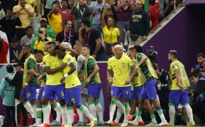 Brazil players celebrate a goal