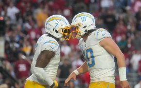 Los Angeles Chargers quarterback Justin Herbert celebrates with tight end Gerald Everett