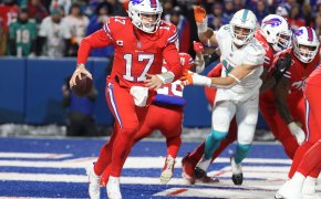 Josh Allen escapes the pressure of the Dolphins defense. Dolphins vs Bills Same-Game Parlay