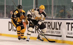 Pittsburgh Penguins Sidney Crosby and Boston Bruins Patrice Bergeron battle along the boards