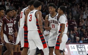 Mississippi Rebels basketball players huddling on the court