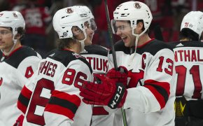 New Jersey Devils center Nico Hischier and center Jack Hughes celebrate victory