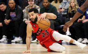 Fred VanVleet dribbling while on the ground