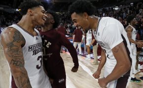 Mississippi State Bulldogs guard Shakeel Moore celebrates with forward Tolu Smith