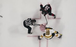 Sebastian Aho, Pavel Zacha face off; Carolina Hurricanes,Boston Bruins