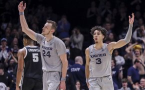 Xavier Musketeers forward Jack Nunge and guard Colby Jones wave to the crowd