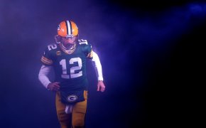 Green Bay Packers quarterback Aaron Rodgers runs out on to the field