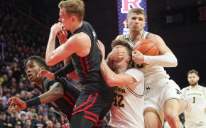 Rutgers and Michigan battle for a loose ball