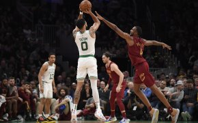 Boston Celtics star Jayson Tatum rises up for a jumpshot.