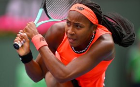Coco Gauff hitting a forehand shot during a tennis match at Indian Wells.