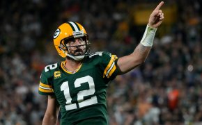 Former Green Bay quarterback Aaron Rodgers pointing