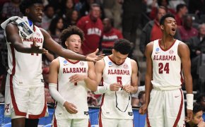 Alabama players celebrating on bench