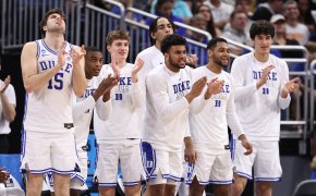 Duke players celebrating win over Oral Roberts