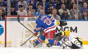 New York Rangers left wing Chris Kreider scores a goal past Pittsburgh Penguins goaltender Tristan Jarry