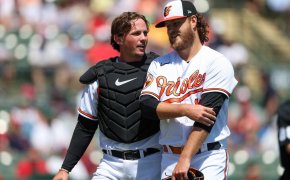 Baltimore Orioles catcher Adley Rutschman talks to starting pitcher Cole Irvin