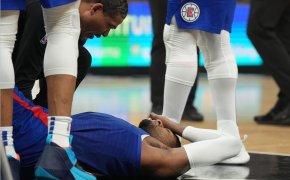 LA Clippers forward Paul George lies on the floor