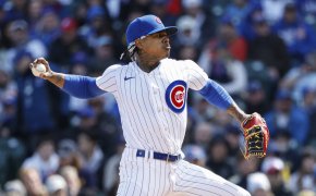 Chicago Cubs starting pitcher Marcus Stroman throwing to home
