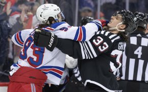 New York Rangers center Mika Zibanejad battles with New Jersey Devils defenseman Ryan Graves