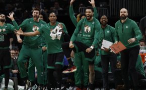 Jayson Tatum and the rest of the Boston Celtics celebrate on the bench.