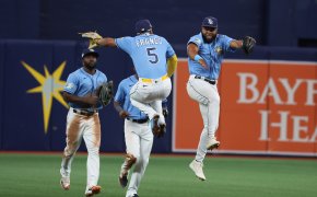 Tampa Bay Rays players celebrating in the outfield.