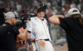 Nick Maton of the Detroit Tigers laughing as he gets water thrown on his after hitting a walkoff.