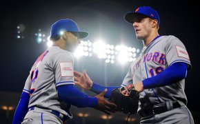 New York Mets shortstop Francisco Lindor greets left fielder Mark Canha