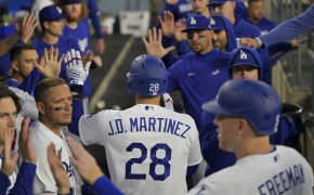Los Angeles Dodgers left fielder J.D. Martinez celebrates in the dugout