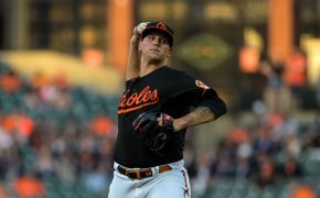 Baltimore Orioles starting pitcher Tyler Wells mid-pitch